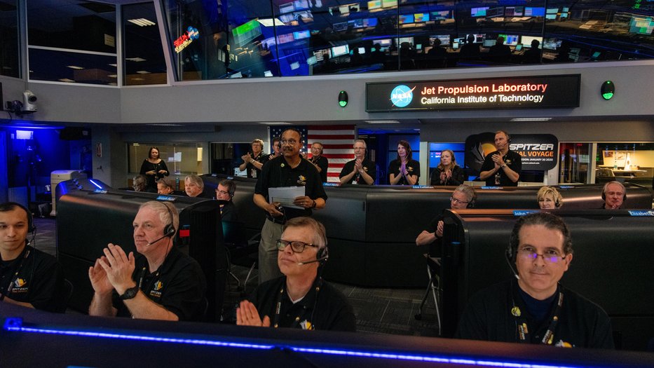JPL staff applauding inside Mission Control.