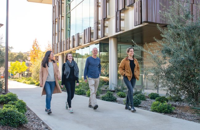 Students and faculty walking together on campus.