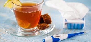 Picture of tea, thermometer, and tissues
