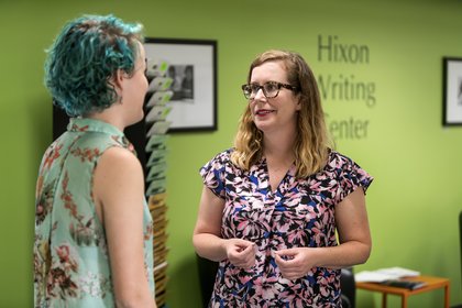 A staff member of the HWC talks with a student